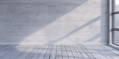 A bright and airy room features large windows that illuminate the space with natural light. The concrete walls and wooden floor create a minimalist atmosphere perfect for various uses.の素材