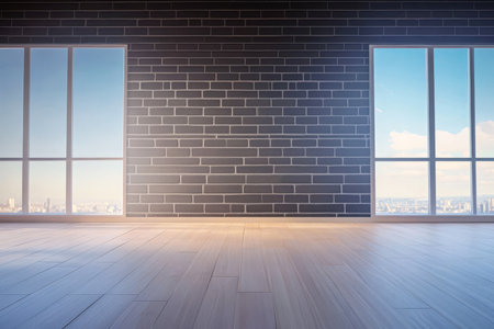 Bright and spacious interior features large windows with city views modern wooden flooring and exposed brick walls. Perfect for creating an inviting atmosphere in an urban environment.の素材