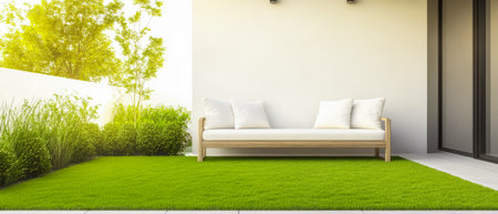 A cozy outdoor seating area features a wooden bench with cushions surrounded by vibrant green grass and plants under warm sunlight creating a serene and inviting atmosphere.の素材