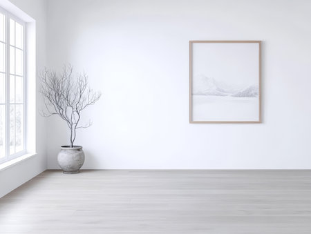 Bright and airy interior space showcases minimalist design with a potted bare tree beside a large window complemented by wall art depicting a snowy landscape creating a serene atmosphere.の素材