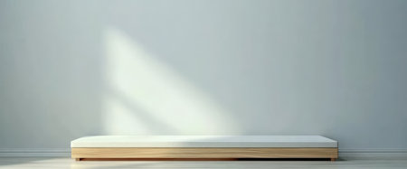 A spacious minimalist interior showcases a wooden platform at the center. Soft natural light streams in creating a serene atmosphere that emphasizes simplicity and calmness.の素材