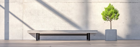A bright and airy space showcases a minimalistic bench made of wood and metal accompanied by a small potted tree. Sunlight casts shadows on the clean white wall.の素材