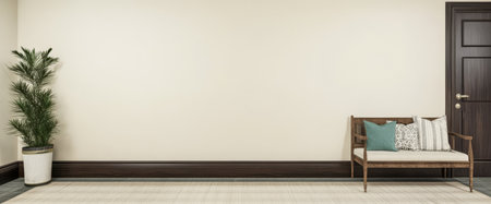 A spacious room showcases a wooden bench adorned with cushions placed near a potted plant. The neutral walls and flooring create a calm atmosphere inviting relaxation and comfort.の素材