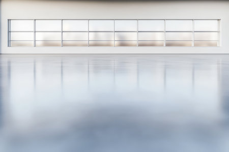 A large clear glass wall spans across a minimalist indoor space. Sunlight filters through casting reflections on the smooth floor. The environment feels bright and open.の素材