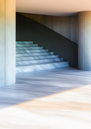 A beautiful stairway leads from a polished floor up to an upper level in a sleek modern building. Sunlight casts soft shadows highlighting the clean lines of the architecture.の素材