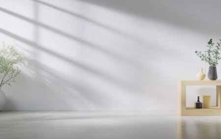 Soft sunlight filters through large windows casting gentle shadows in a minimalist space. Simple decor includes vases and a wooden table creating an inviting atmosphere.の素材