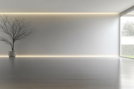 A minimalist interior showcases a barren tree in a pot against a bright white wall illuminated by natural light filtering through large windows creating a calm atmosphere.の素材