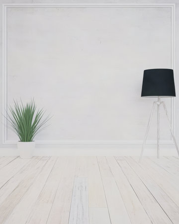 A simple and clean interior features a tall green plant in a white pot next to a sleek black lamp on a tripod stand. The light wooden floor adds warmth to the bright neutral walls.の素材