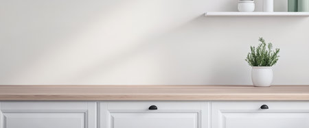 A clean and minimalist kitchen countertop features a wooden surface with white cabinets below. Above a simple shelf displays green plants and decorative jars enhancing the fresh ambiance.の素材