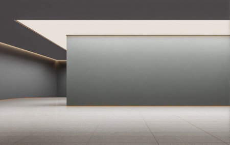 Spacious interior features a smooth gray wall illuminated by soft lighting emphasizing the minimalist design. The clean lines and open space create a serene atmosphere ideal for art displays.の素材