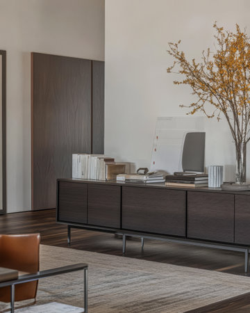 A sleek workspace features contemporary furniture including a dark wooden cabinet and a stylish chair. Warm lighting enhances the minimalist aesthetic complemented by a decorative vase with branches.の素材