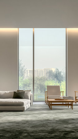 This spacious living room features minimalistic design elements, large windows allowing natural light, and a serene view of trees and buildings in the distance, creating a tranquil atmosphere.の素材