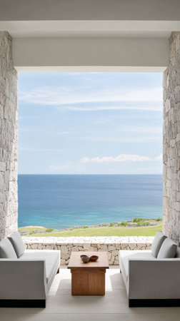 Bright, spacious lounge designed with minimalist furniture offers a stunning view of the blue ocean and sky, creating a tranquil atmosphere perfect for relaxation.の素材