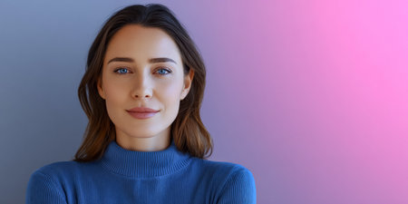 A woman stands confidently with her arms crossed, showcasing her blue eyes and warm smile. She wears a soft blue sweater in front of a gradient background that blends pink and purple hues.の素材