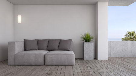 A stylish grey sofa sits on wooden flooring in a modern outdoor space. Two decorative potted plants add greenery, and the ocean view creates a relaxing atmosphere on a sunny day.の素材