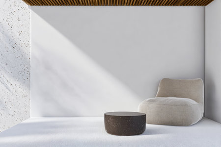 A bright room features a soft beige chair next to a round dark table. White walls and a wooden ceiling contribute to a clean, minimal aesthetic suitable for relaxation.の素材