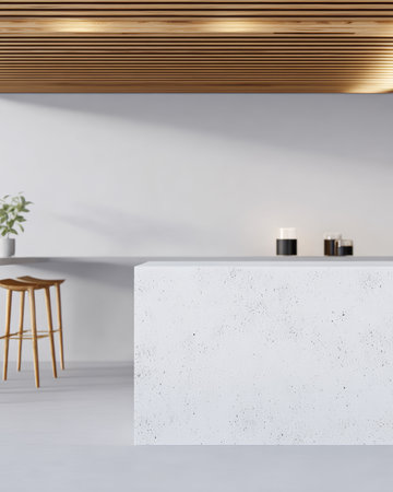 A clean, minimalist interior displays a white countertop with a simple wooden stool. Soft lighting illuminates the space, emphasizing a relaxed and modern atmosphere.の素材