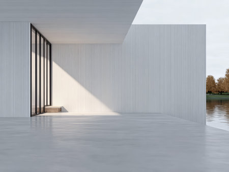 A sleek, minimalistic architectural space sits next to a body of water, showcasing clean lines and abundant natural light streaming through large windows.の素材