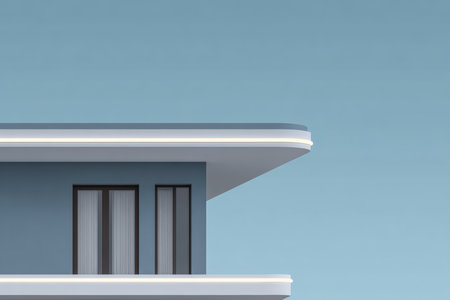 A contemporary building displays a sleek design with sharp lines and large windows. The structure is set against a clear blue sky, highlighting its modern architecture.の素材