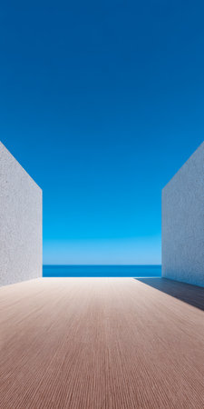 Bright blue sky meets a serene ocean view in an open space framed by two minimalist walls. The clean lines and natural light create a calm atmosphere.の素材