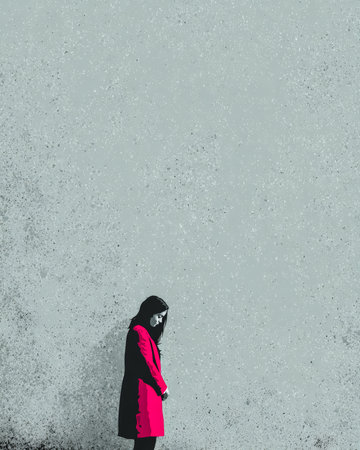 A person wearing a bright red coat stands quietly against a plain gray wall. The atmosphere feels somber as the individual gazes downward, lost in thought.の素材