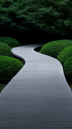 A smooth, curvy pathway leads through beautifully manicured green hedges in a tranquil garden. Sunlight filters gently through the trees, creating a calming atmosphere.の素材