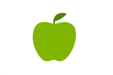 A bright green apple sits alone on a clean white background, showcasing its smooth skin and vibrant color. This simple display highlights freshness and health, inviting attention.の素材