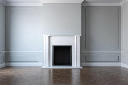 A spacious living room features a stylish minimalist fireplace centered on a neutral grey wall. The hardwood floor complements the modern design and adds warmth to the decor.の素材
