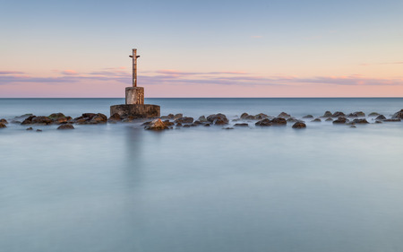 Beautiful sunset on the beach of Aguilas where the old lighthouse is locatedの写真素材