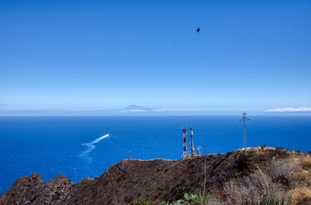 Coast of the island of La Palma, Canary Islands, Spain A view of Mount Teide on the horizon surrounded by cloudsの写真素材