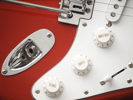Close-up of a red electric guitar