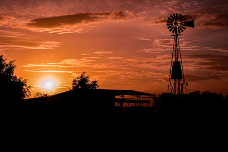 Sunset in the field. Windmillの写真素材