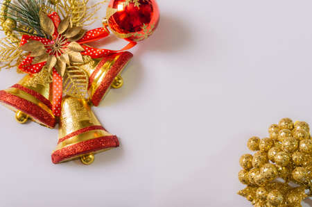 white christmas background with red golden wreath, christmas ball and bells, candle and flowersの写真素材