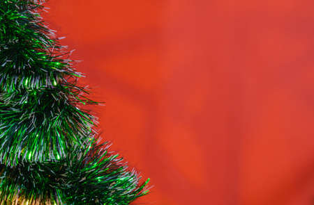 red christmas background decoration of bells gift box, red and golden wreath, christmas balls and flowersの写真素材