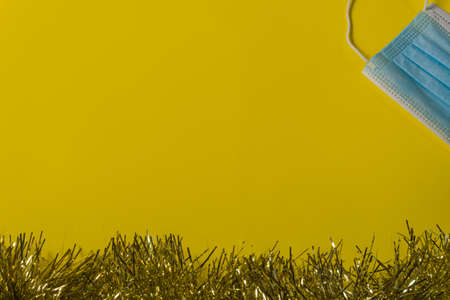 yellow christmas background with yellow wreathの写真素材