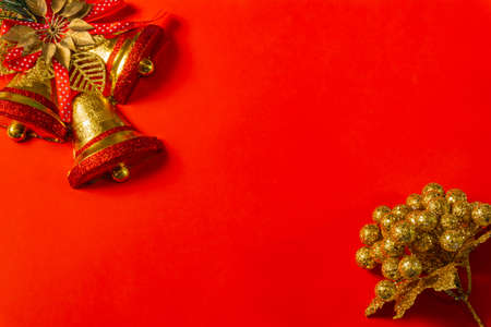 red christmas background decoration of bells gift box, red and golden wreath, christmas ballsの写真素材
