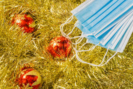 golden wreath christmas background with christmas balls and flowersの写真素材