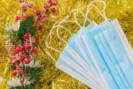 golden wreath christmas background with christmas balls and flowersの写真素材
