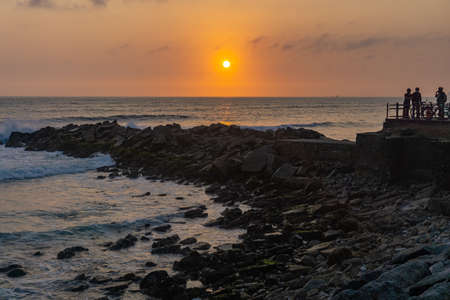 Sunset Landscape in the shore of Lima Peru, pile of rocksの写真素材