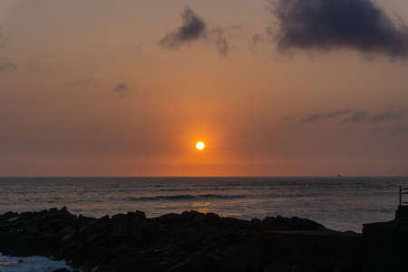Sunset Landscape in the shore of Lima Peru, pile of rocksの写真素材