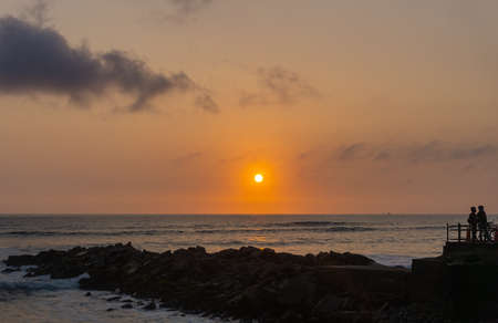 Sunset Landscape in the shore of Lima Peru, pile of rocksの写真素材