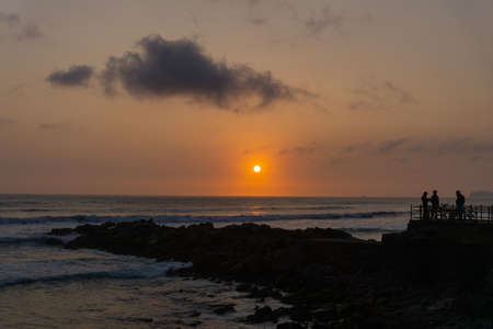Sunset Landscape in the shore of Lima Peru, pile of rocksの写真素材