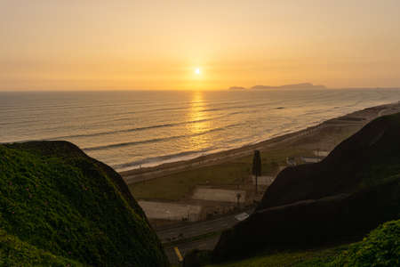 Sunset Landscape in the shore of Lima Peru, view from a cliffの写真素材
