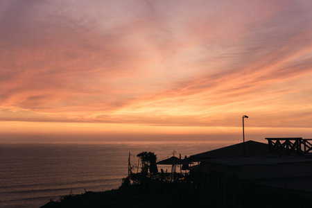 Beautiful sunset in Lima Peru, backlighting of the coast, magenta sky, golden hour,の写真素材