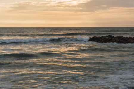 Beautiful sunset in Lima Peru, bright sky and underexposed beach, golden hour, orange skyの写真素材