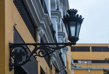 classical iron black streetlight in historical center of Lima with unfocused backgroundの写真素材