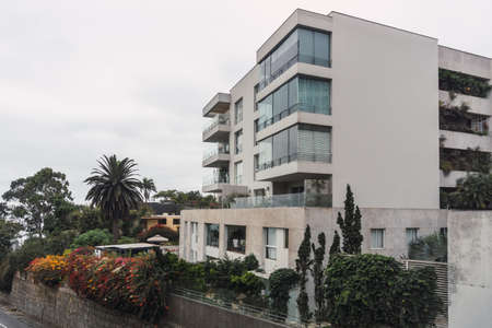luxurious apartments building surrounded by trees and plants in Chorrillos Lima Peruのeditorial素材