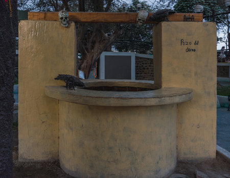 Ica, Peru - December, 27, 2022: Wishing well in Cachiche Witch Theme Park, Ica Peru. The words "wishing well" mean "wishing well"のeditorial素材