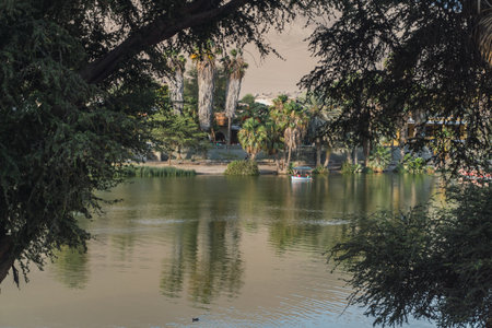 People taking a boat ride in the Huacachina lagoon ica Peruの写真素材