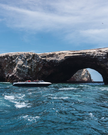 Unrecognizable people on boat sightseeing in the Ballestas Islands at Paracas, Ica Peruの写真素材